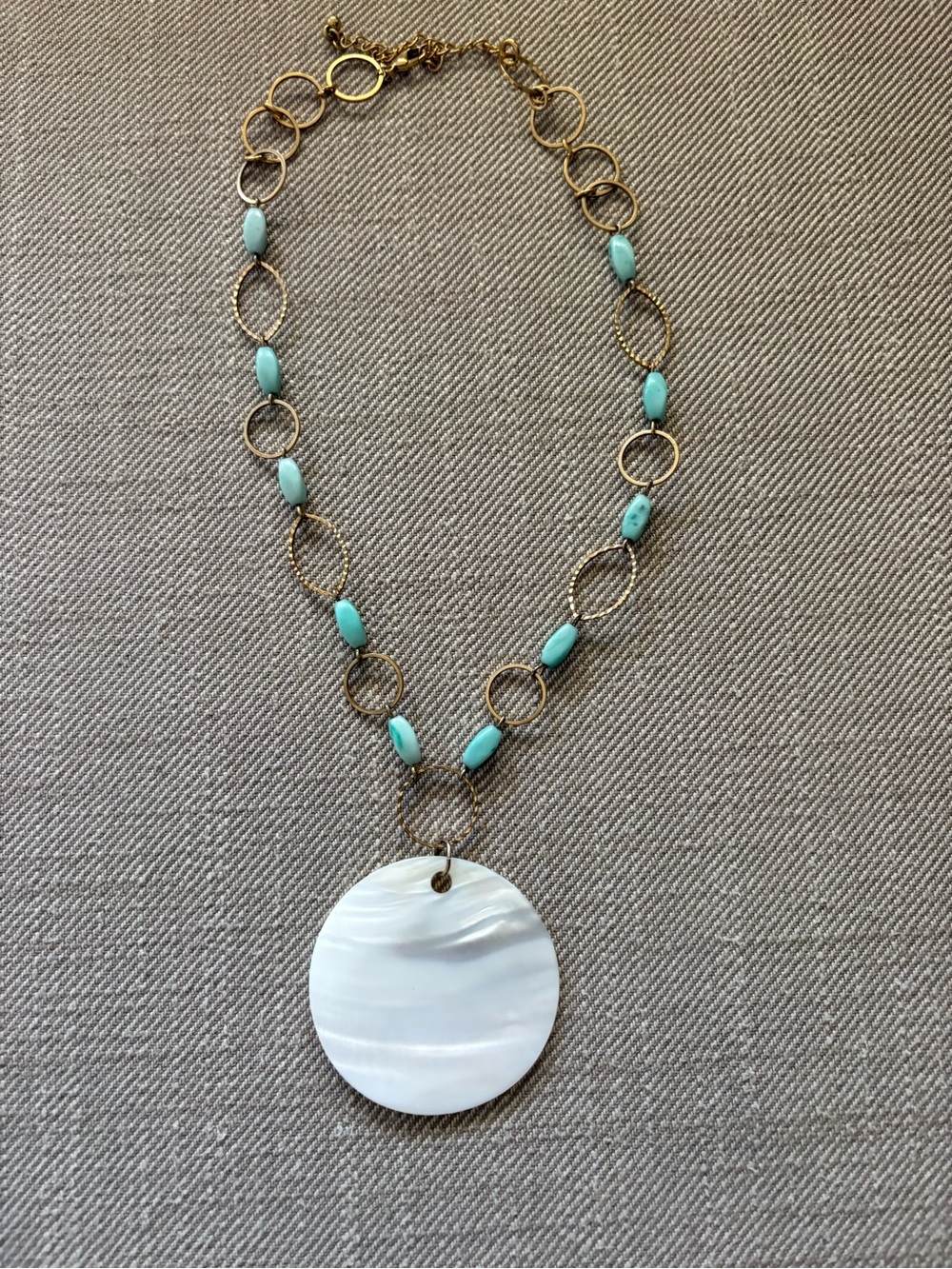 Vintage Avon gold tone turquoise-colored beads large mother of pearl pendant